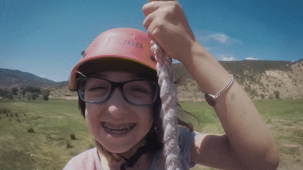 Gif showing campers with special needs zip lining.