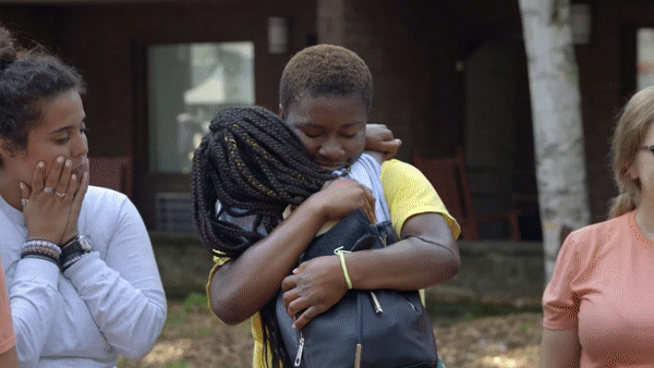 Gif showing campers waving and hugging in preparation to go home.